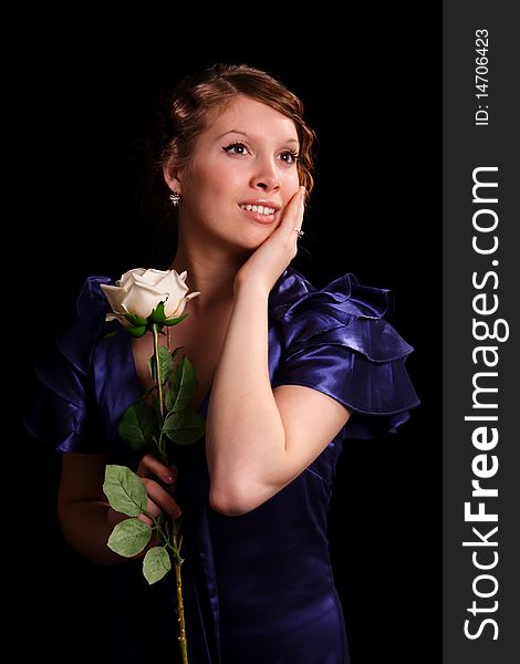 Portrait of the beautiful young woman with a rose. Portrait of the beautiful young woman with a rose.