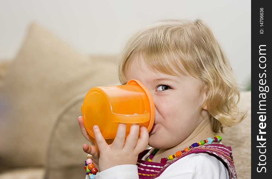 Toddler Girl Drinking From A Cup