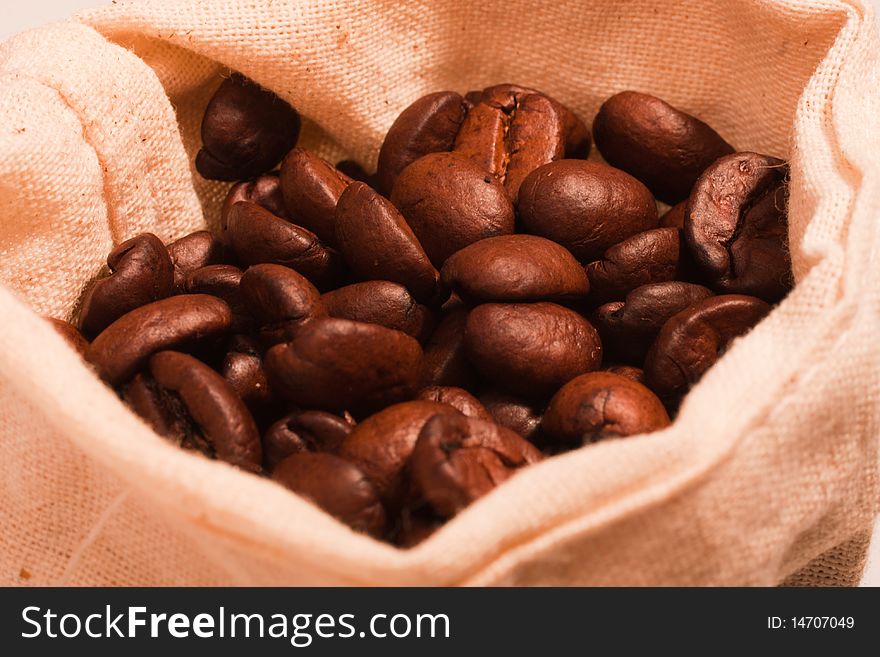 Coffee beans in a canvas bag (selective focus). Coffee beans in a canvas bag (selective focus)