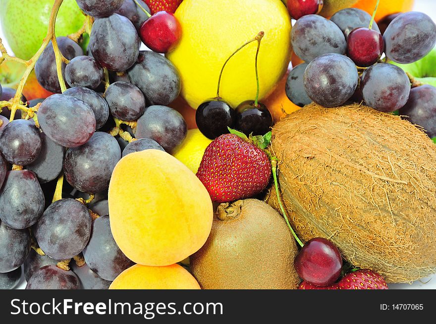 Background of bright exotic fruit and berries. Background of bright exotic fruit and berries