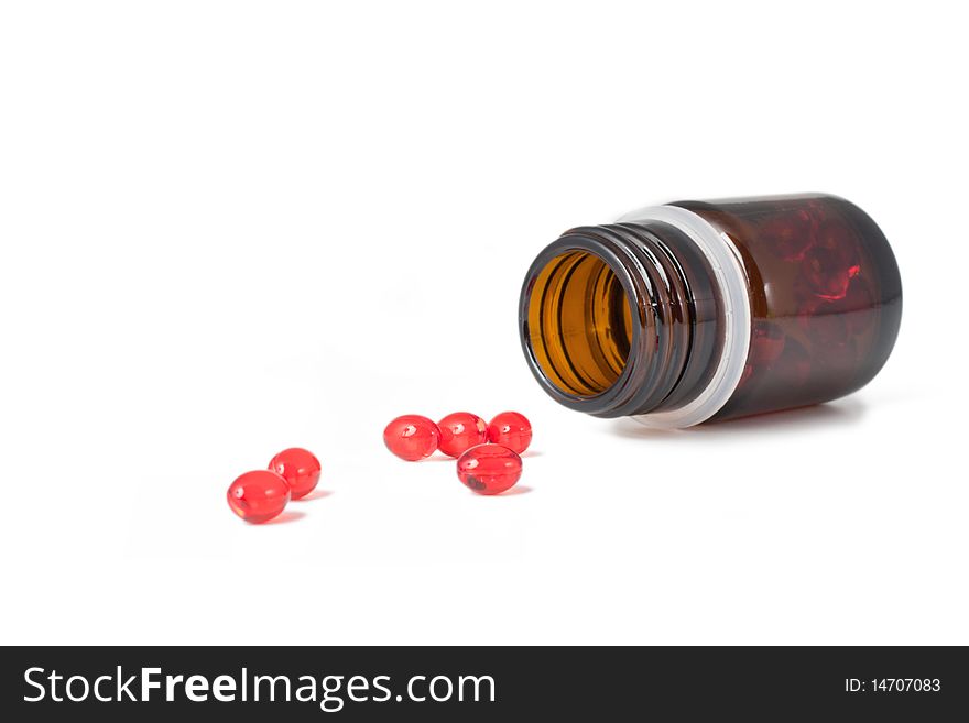 Vitamin tablets on a white background (selective focus)