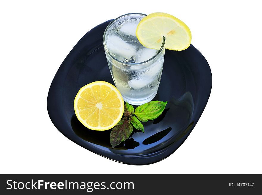 Isolated glass of lemon water. Isolated glass of lemon water