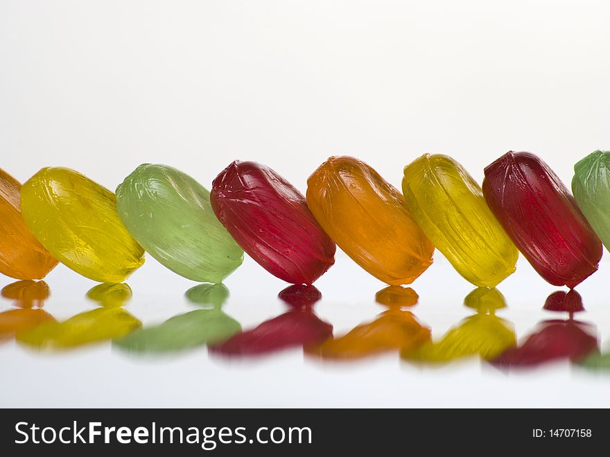 Row Of Bonbons With Reflection