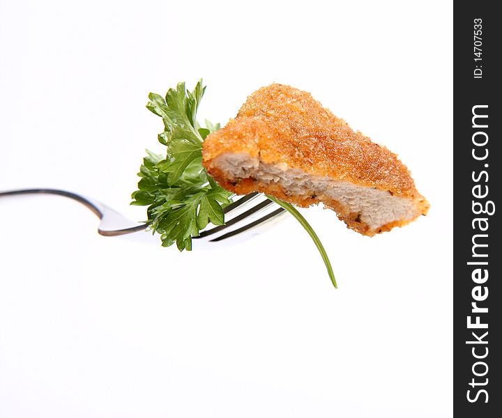 Piece Of Pork Chop With Parsley On A Fork