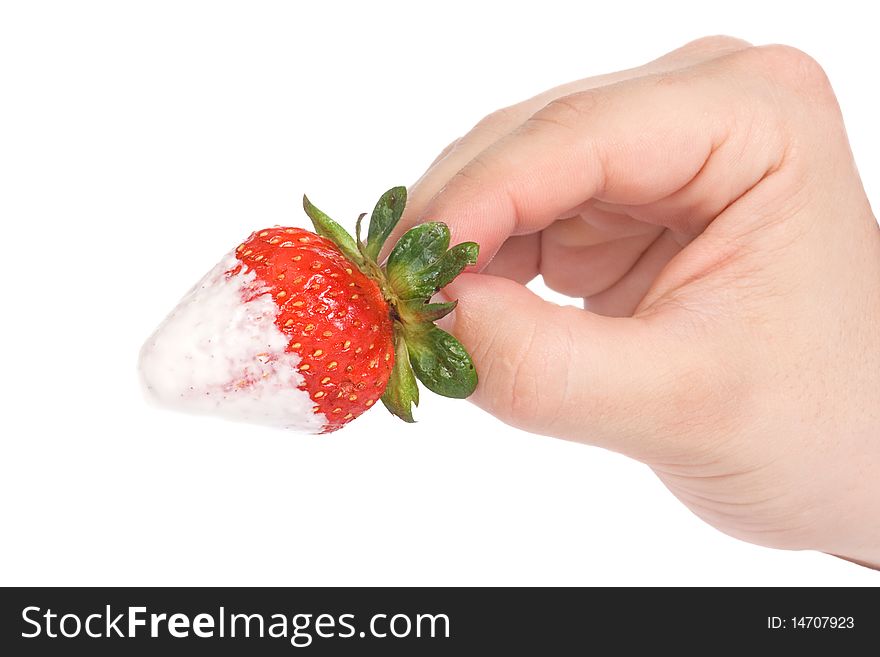 Caucasian hand with strawberry on white