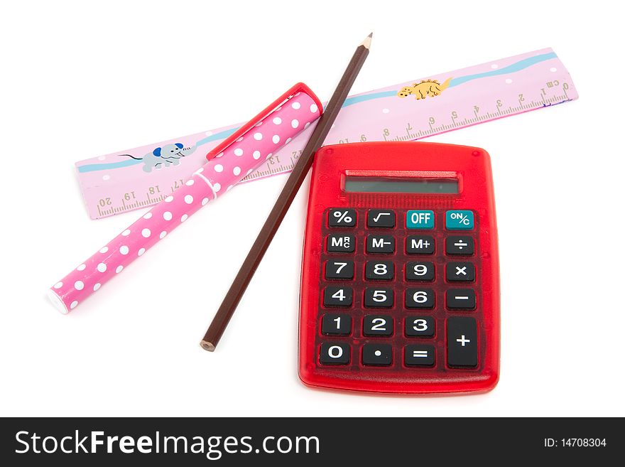 A red calculator and office supplies isolated over white