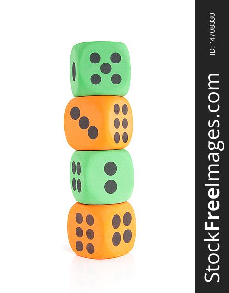 Four colorful stacked green and orange dice isolated over white. Four colorful stacked green and orange dice isolated over white