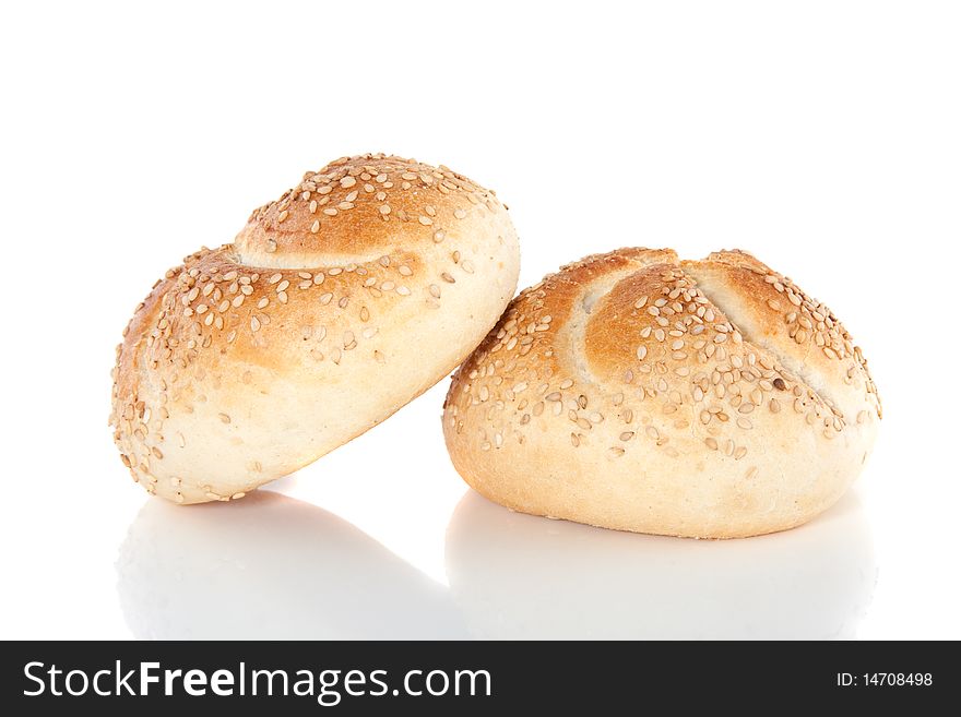 Two white sesame rolls isolated over white