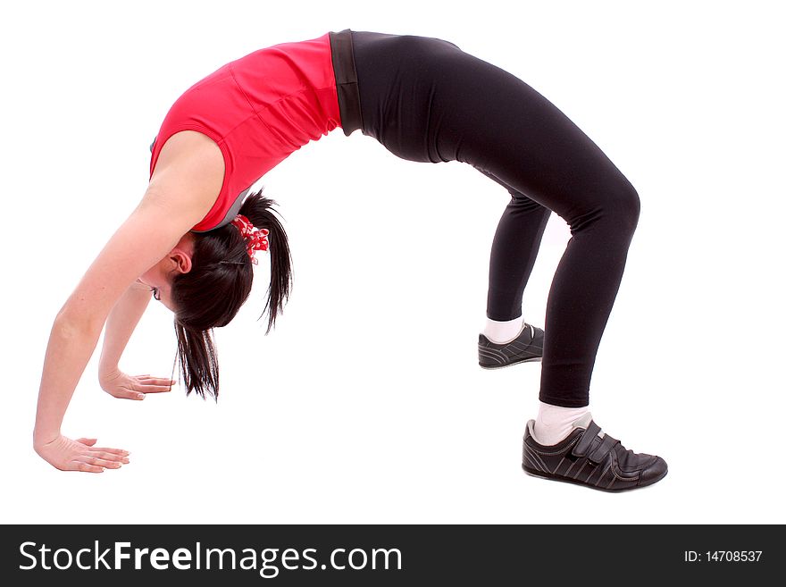 Pretty young girl in the gymnastic pose isolated on white background