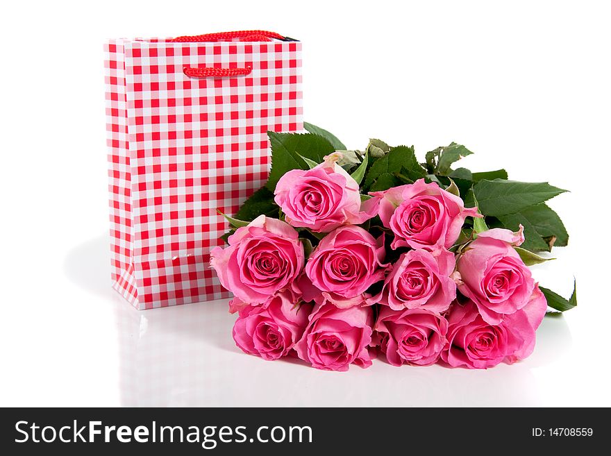 Pink roses and a giftbag