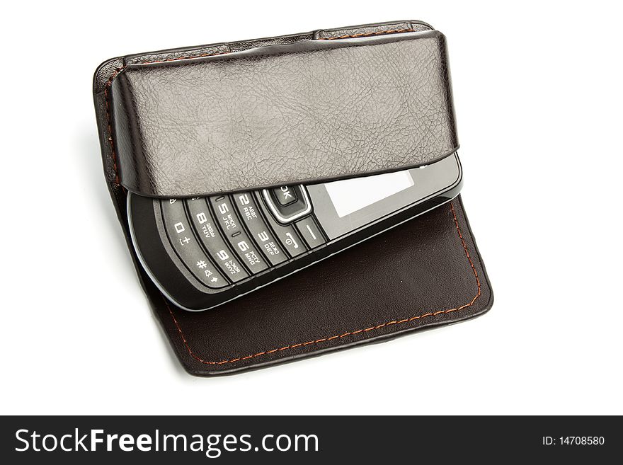 Cell phone in leather case isolated on white. Cell phone in leather case isolated on white