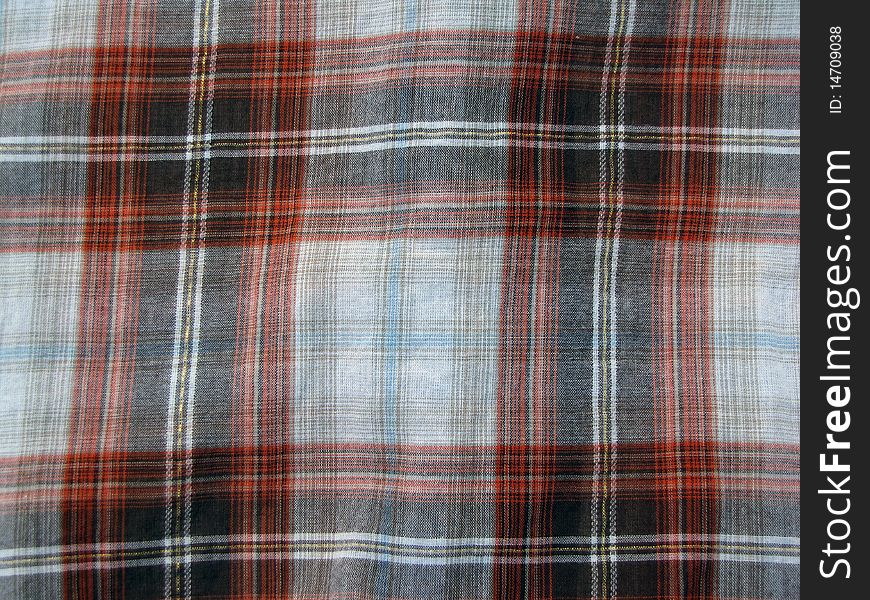 Orange and black striped plaid used as a background. Orange and black striped plaid used as a background