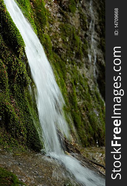 Waterfall and moss on the stones