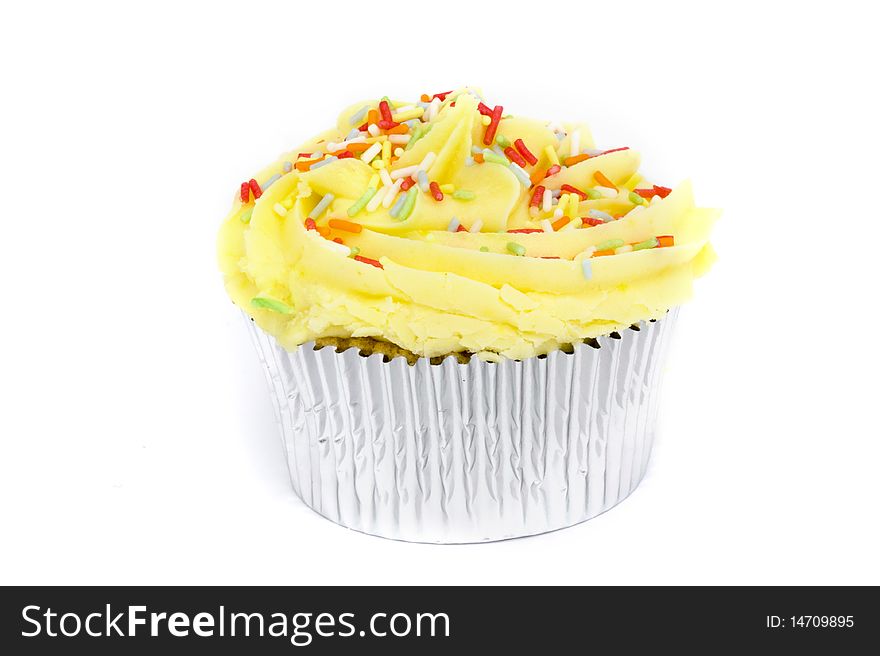Yellow cupcake on a white background. Yellow cupcake on a white background