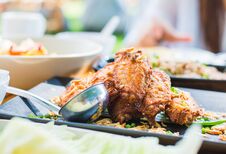 Fried Chicken Wings On Wooden Table. Breaded Crispy Fried Kentucky Chicken Tasty Dinner Royalty Free Stock Photography