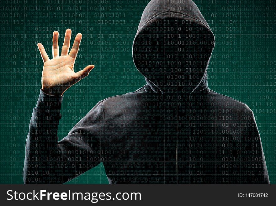 Dangerous Hacker Over Abstract Digital Background With Binary Code. Obscured Dark Face In Mask And Hood. Data Thief