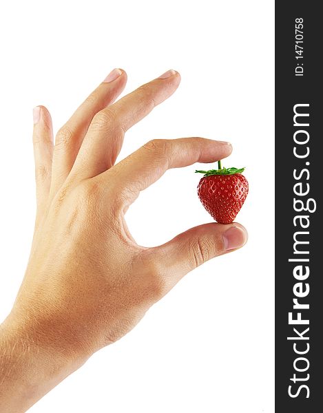 Fresh strawberry in a hand on a white background