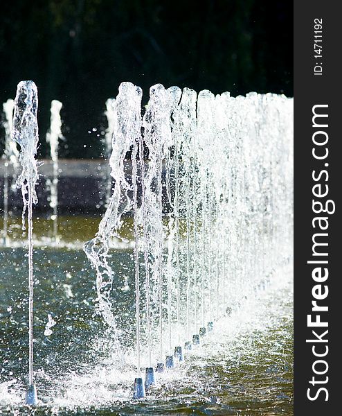 A park fountain, water fall