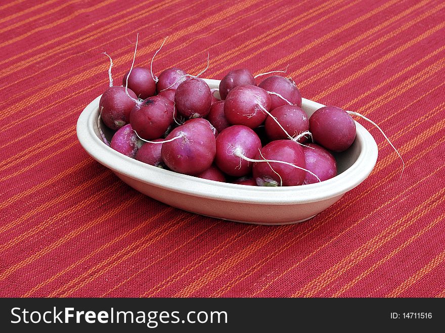 Bowl of radishes on a kitchen table