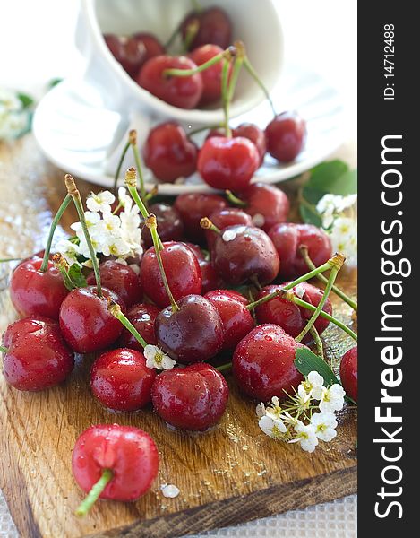 Beautiful  fresh cherry in a board with white cup