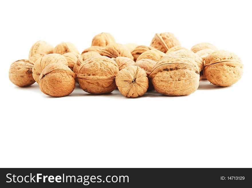 A heap of nuts on white