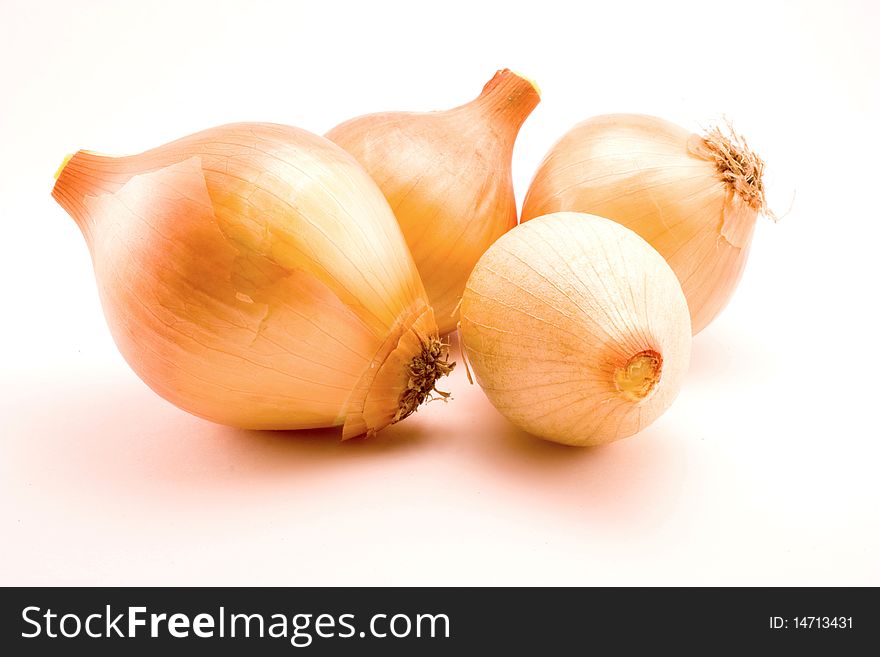 Few raw onions isolated on white background