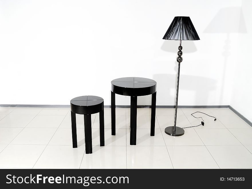 Black chair, table and floor lamp