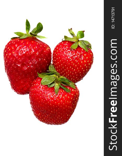 Three red ripe strawberries on a white background. Three red ripe strawberries on a white background