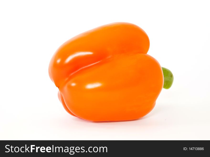 Orange bell pepper above white