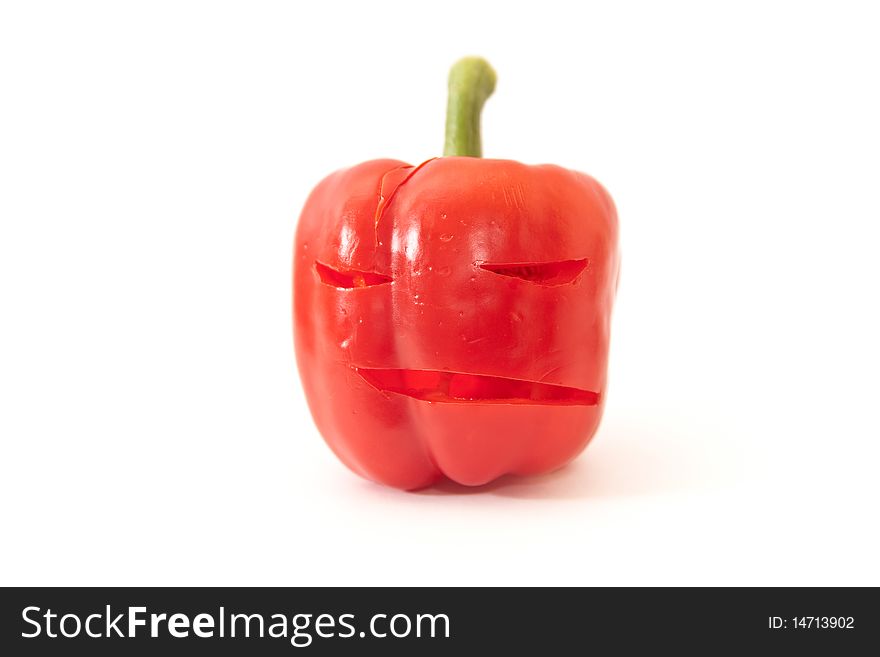 Red bell pepper with angry face above white. Red bell pepper with angry face above white