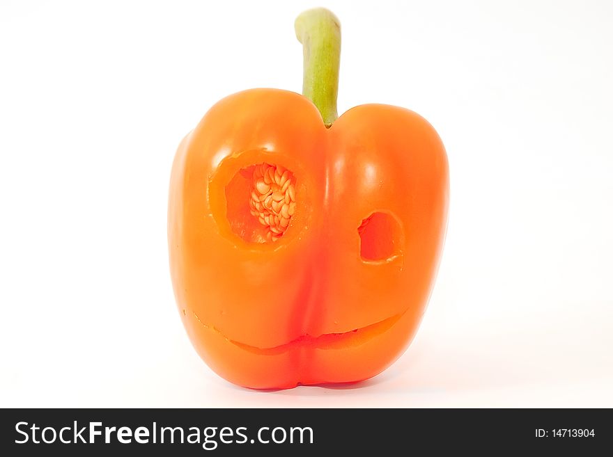 Smile orange bell pepper with face above white. Smile orange bell pepper with face above white