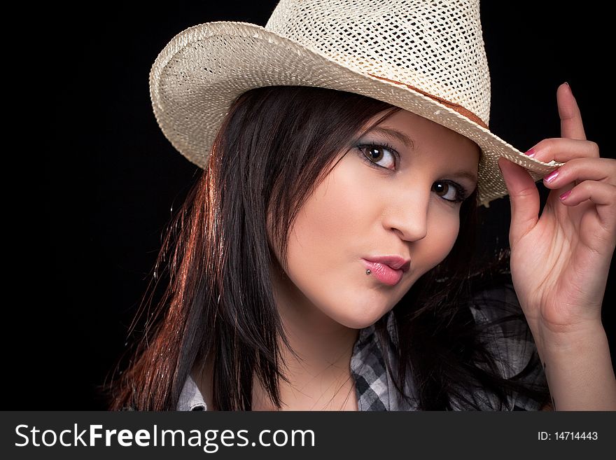 Young beautiful woman wearing cowboy hat. Young beautiful woman wearing cowboy hat