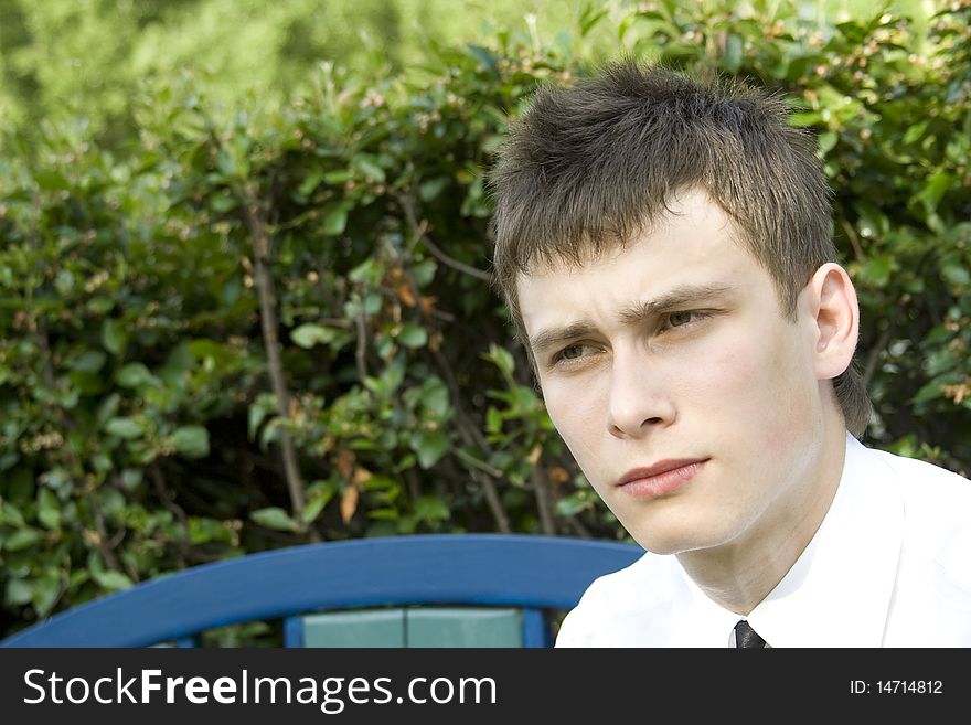 Teenager On Park Bench