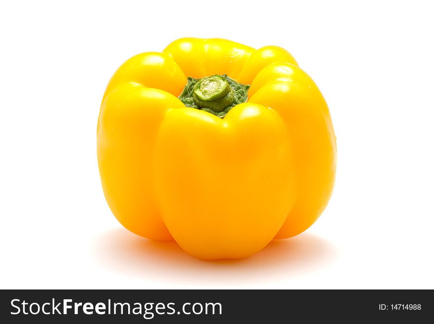 A yellow bell pepper isolated on a white background