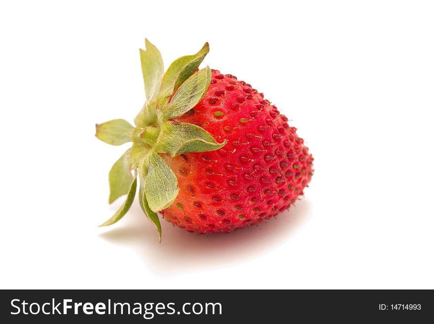 A watery ripe strawberry isolated on a white background