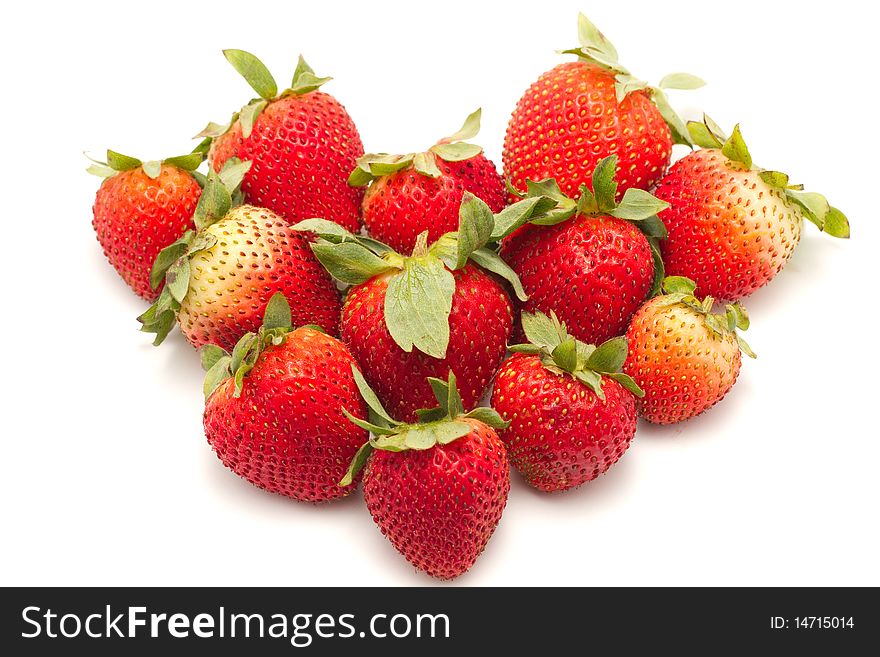 Strawberries in a heart shape isolated on a white background. Strawberries in a heart shape isolated on a white background