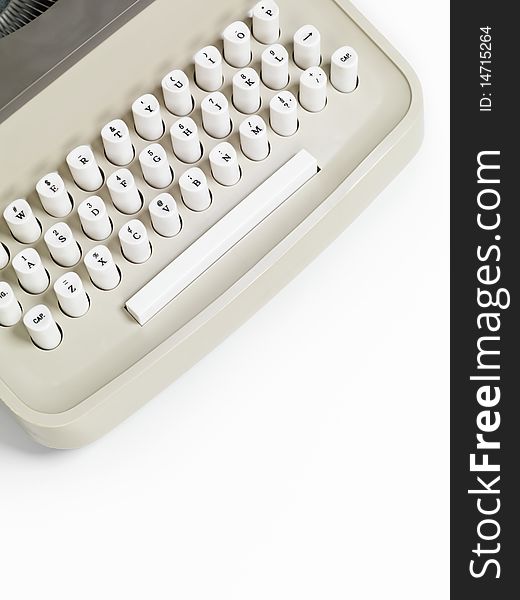 Closeup of a retro typewriter keyboard isolated on white background
