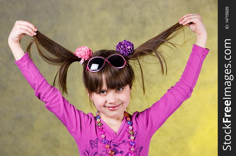 Portrait of young happy girl with ponytails. Portrait of young happy girl with ponytails