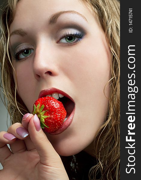 Girl Bitting Strawberry