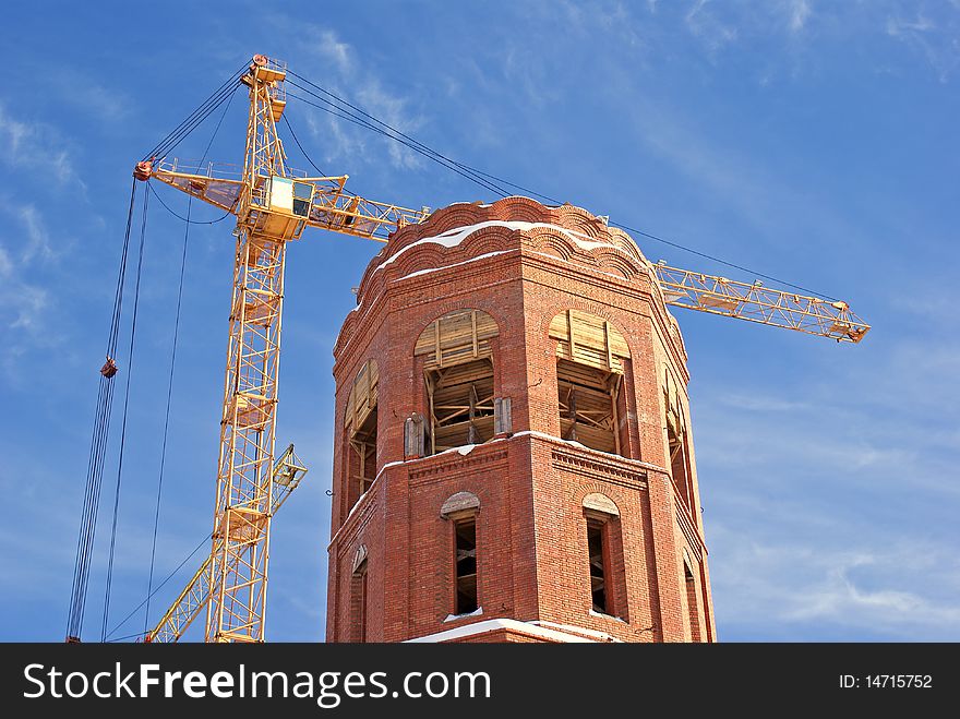 High-altitude tower crane necessary for elevation cargo and architectural construction  by erection new-built building