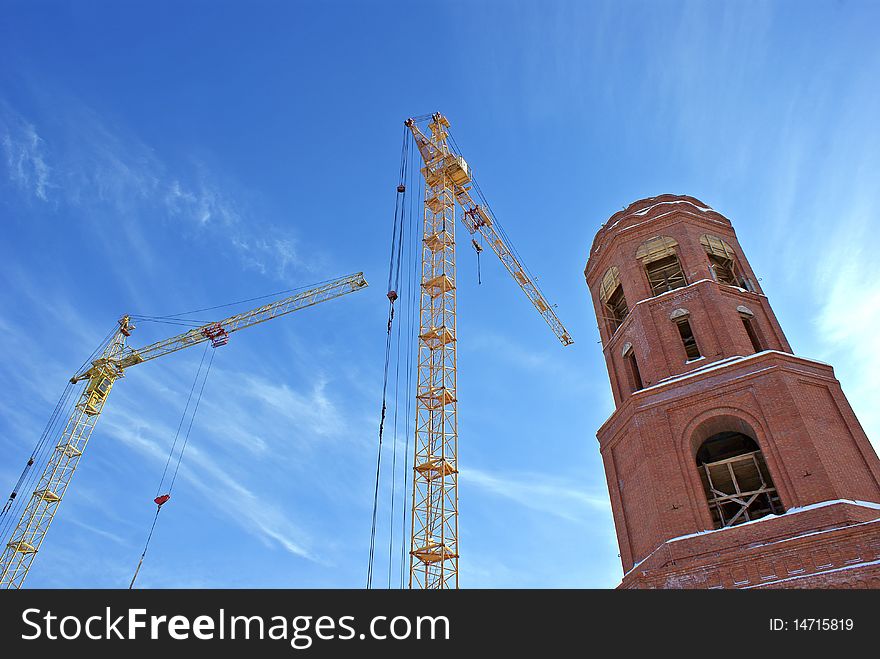 High-altitude tower crane necessary for elevation cargo and architectural construction  by erection new-built building