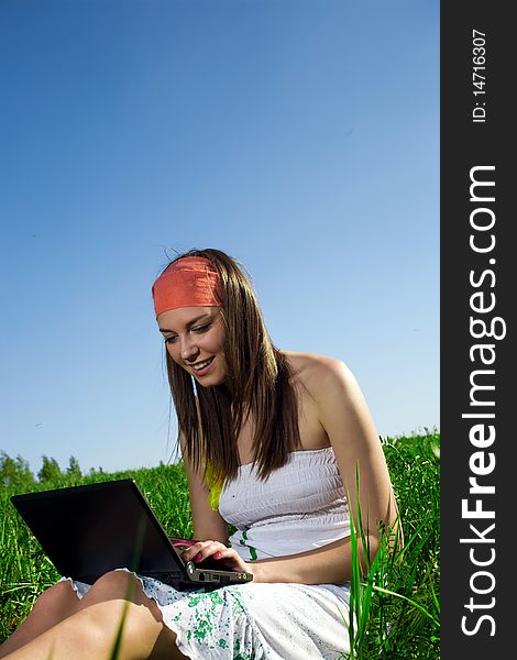 Long-haired Girl With Notebook On Grass