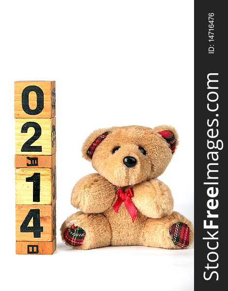 A cute little Brown teddy bear with valentine's calendar. A cute little Brown teddy bear with valentine's calendar