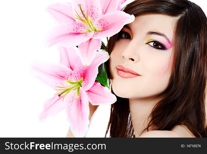 Shot of a young beautiful woman with a lily flowers. Isolated over white background. Shot of a young beautiful woman with a lily flowers. Isolated over white background.