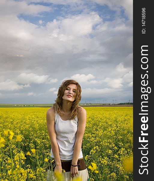 Young girl resting in field. Young girl resting in field