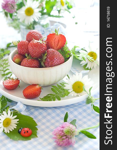Fresh strawberries in ceramic bowl