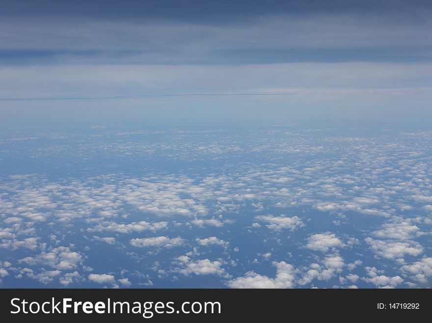 Airplane view above the clouds. Airplane view above the clouds