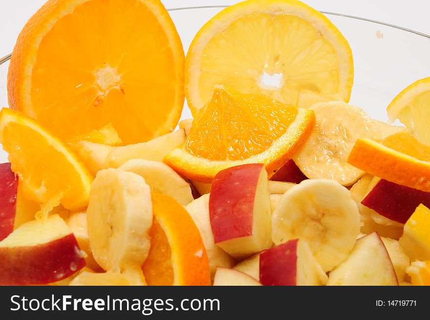 Cut fruit in a glass bowl. Cut fruit in a glass bowl