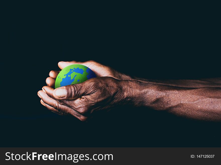 Old men hand holding the earth, environment concept, save the earth concept, climate change. Old men hand holding the earth, environment concept, save the earth concept, climate change