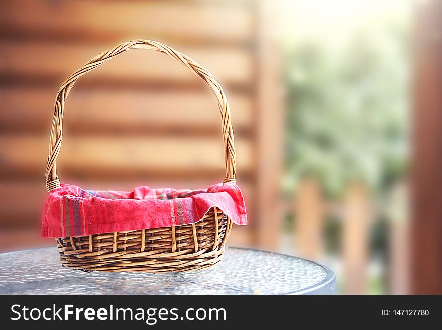 Empty basket with red picnic cloth outdoor copy space